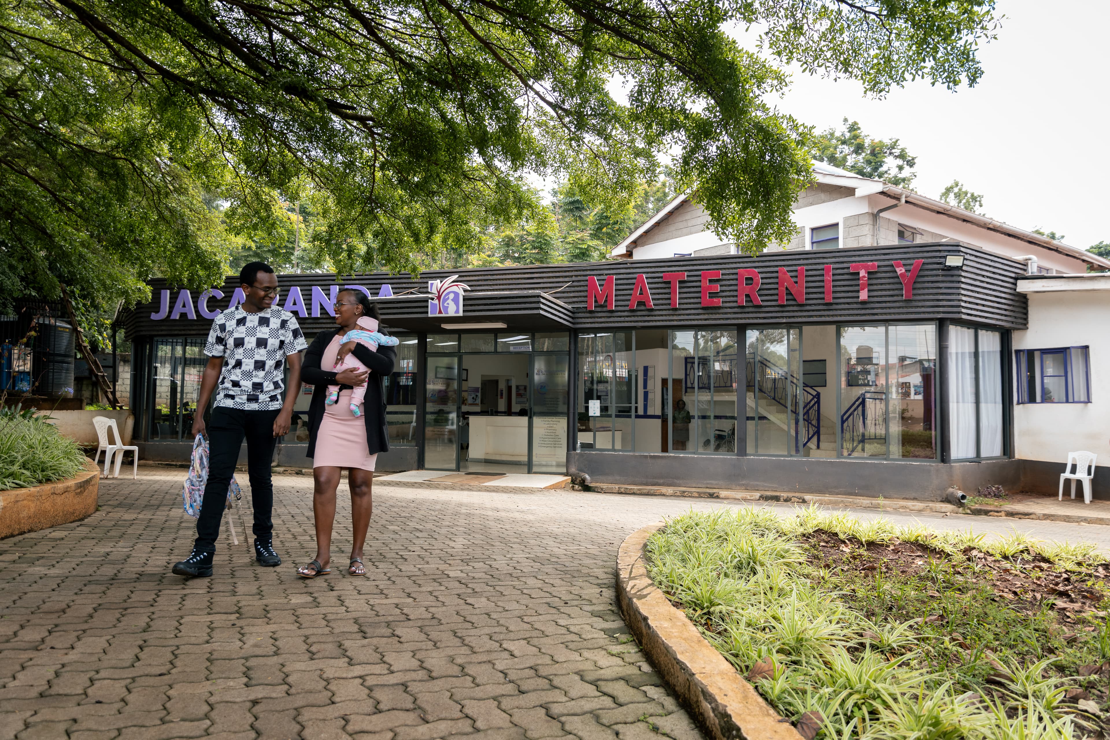 A couple leaving Jacaranda Maternity, Ruaka.